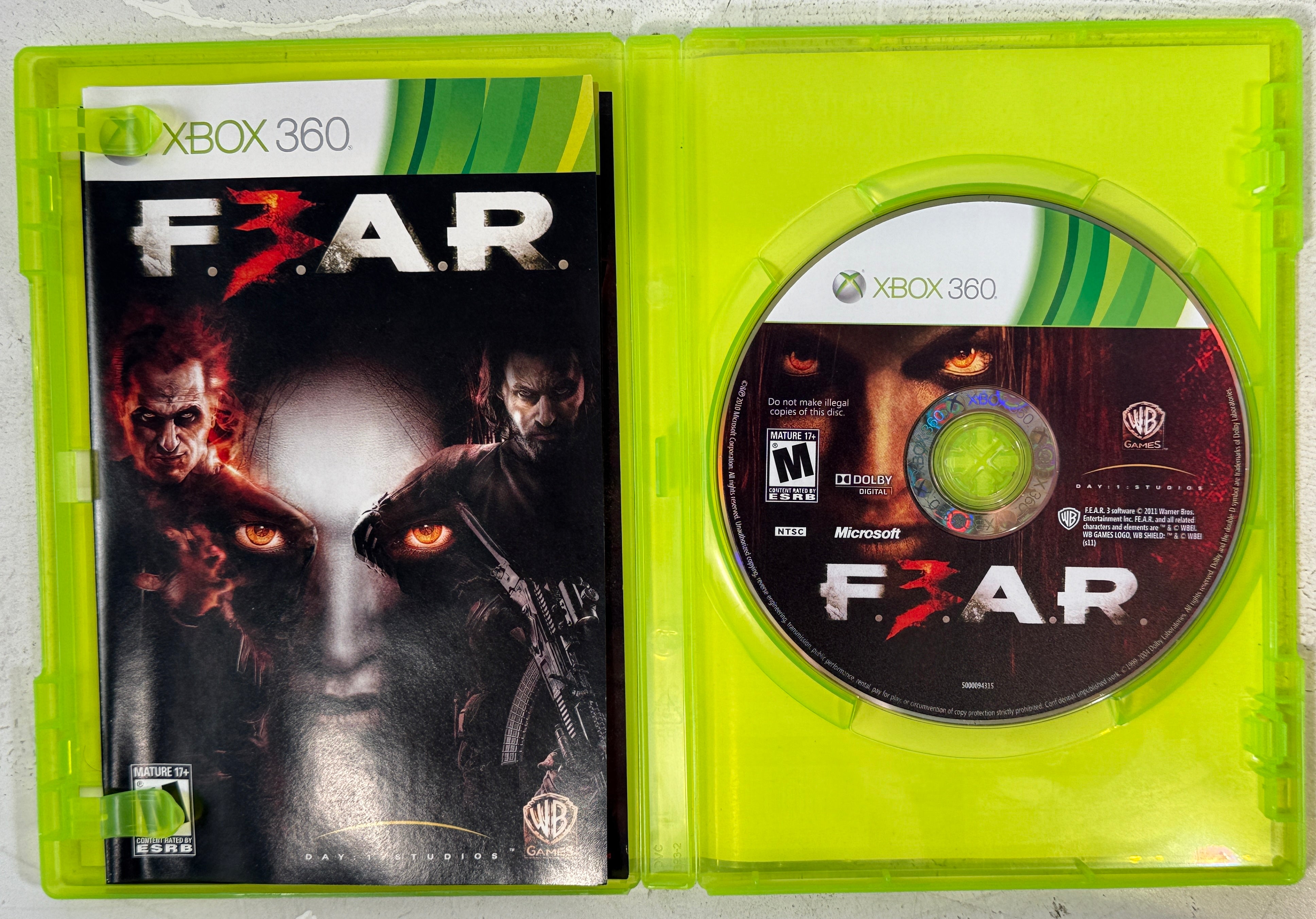 Play F.E.A.R. 3 on Xbox 360. Complete in box with original manual. Classic horror FPS with co-op gameplay. Tested, clean disc, ready to play.