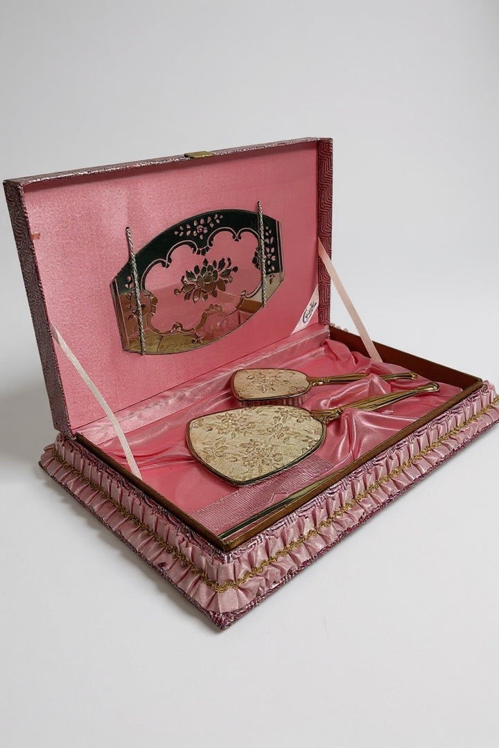 Vintage Claude vanity set with mirror, brush &amp; comb in original pink satin box. Elegant 1950s dressing table décor collectible.