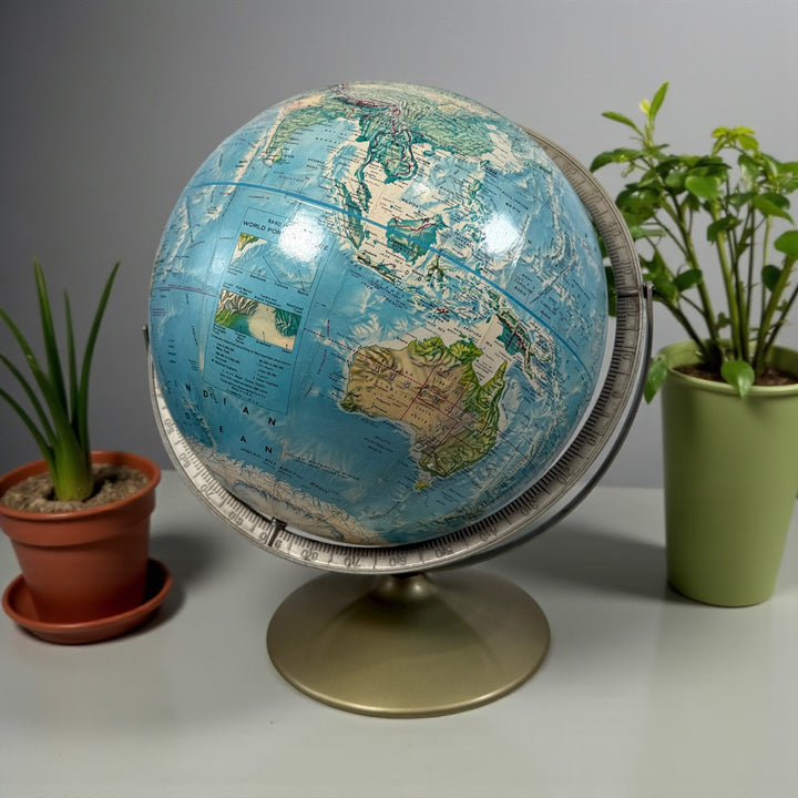 Vintage 1990 Rand McNally raised relief world globe showing USSR and unified Germany — Cold War era map with textured terrain and metal stand, Made in USA.