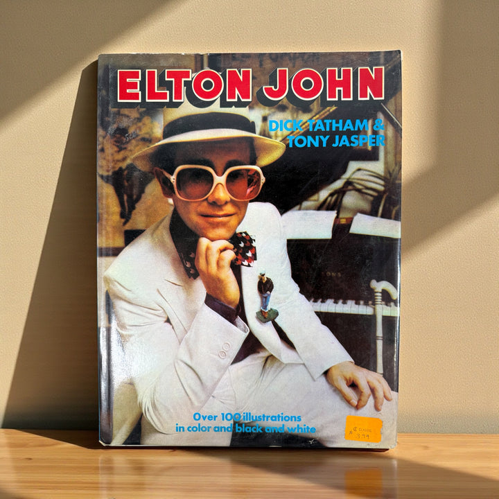 Vintage 1976 Elton John photo biography by Tatham & Jasper, Octopus Books. 100+ color photos of the Rocket Man in his prime. Collectible 70s music book.