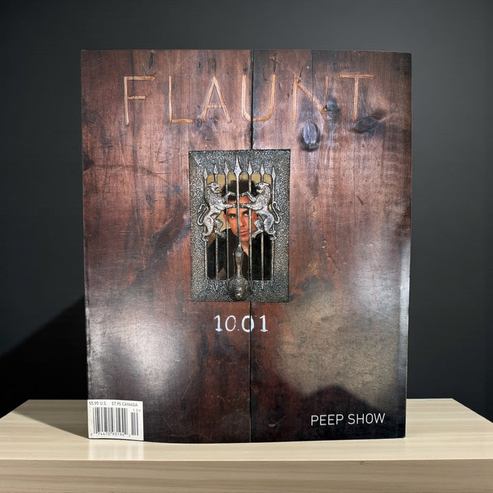 Vintage Flaunt Magazine Oct 2001 with Ben Stiller cover and Leonard Cohen feature. VG+ with original You Glow Ghoul insert. Collectible early 2000s issue.