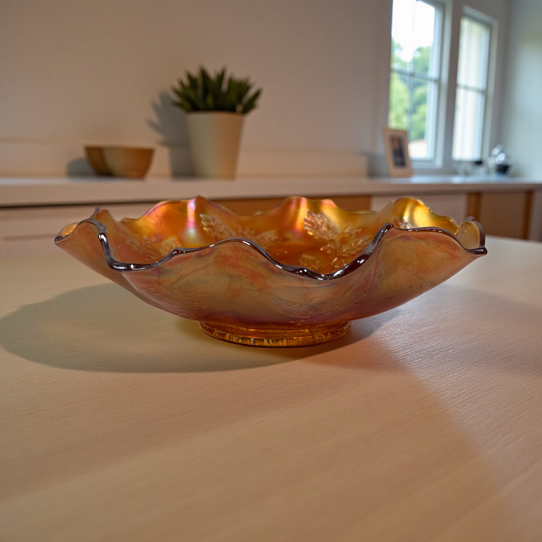 Vintage Fenton marigold carnival glass bowl in Leaf &amp; Berry pattern with ruffled edge. Strong iridescence, early 1900s American glass. VG condition.