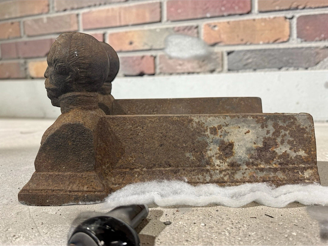 Antique French cast iron chenets with male bust fronts. Decorative fireplace firedogs / andirons with aged black patina and historic hearth appeal.
