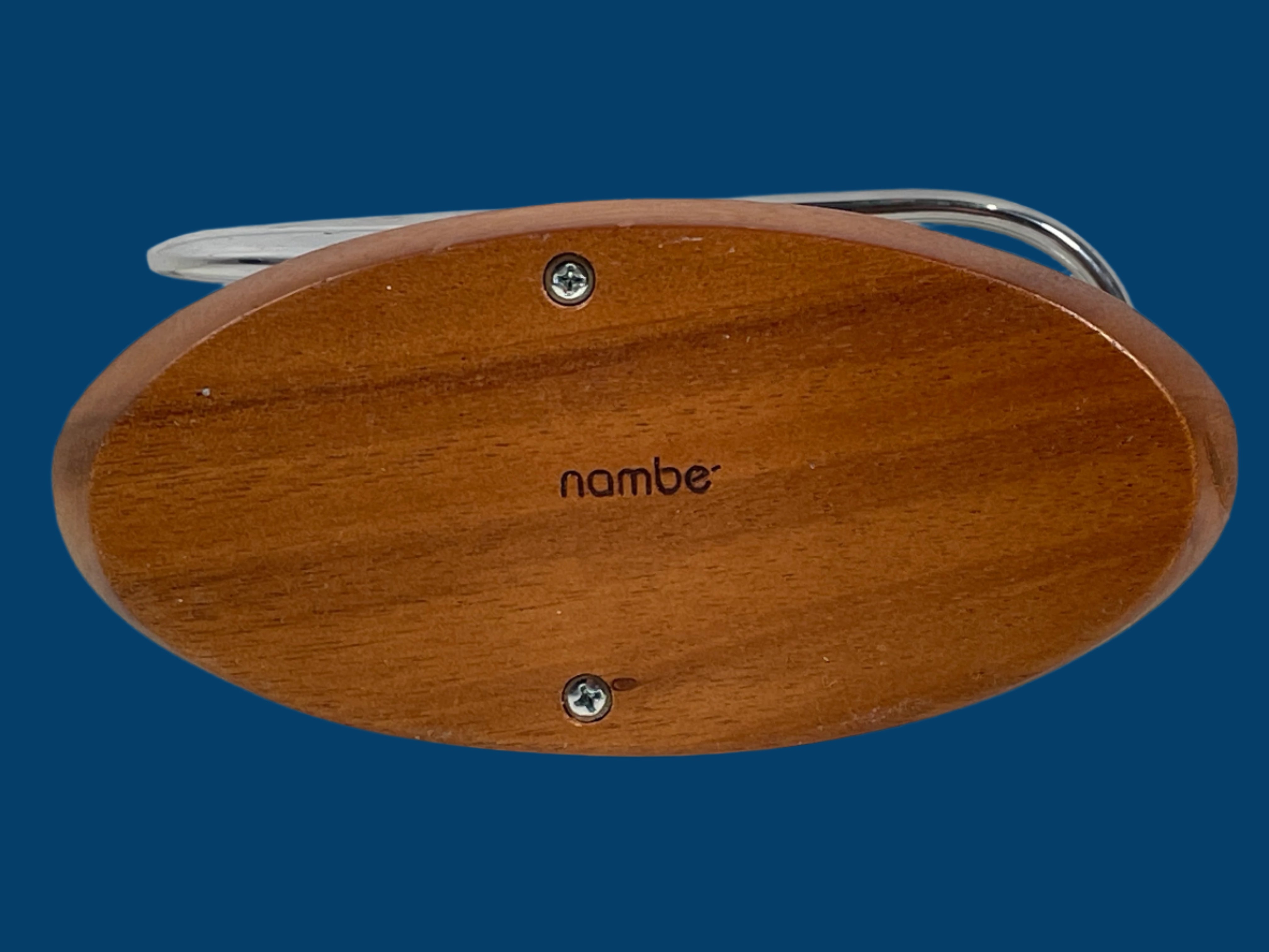 Nambé Napkin Holder – Sculptural Alloy & Wood Design