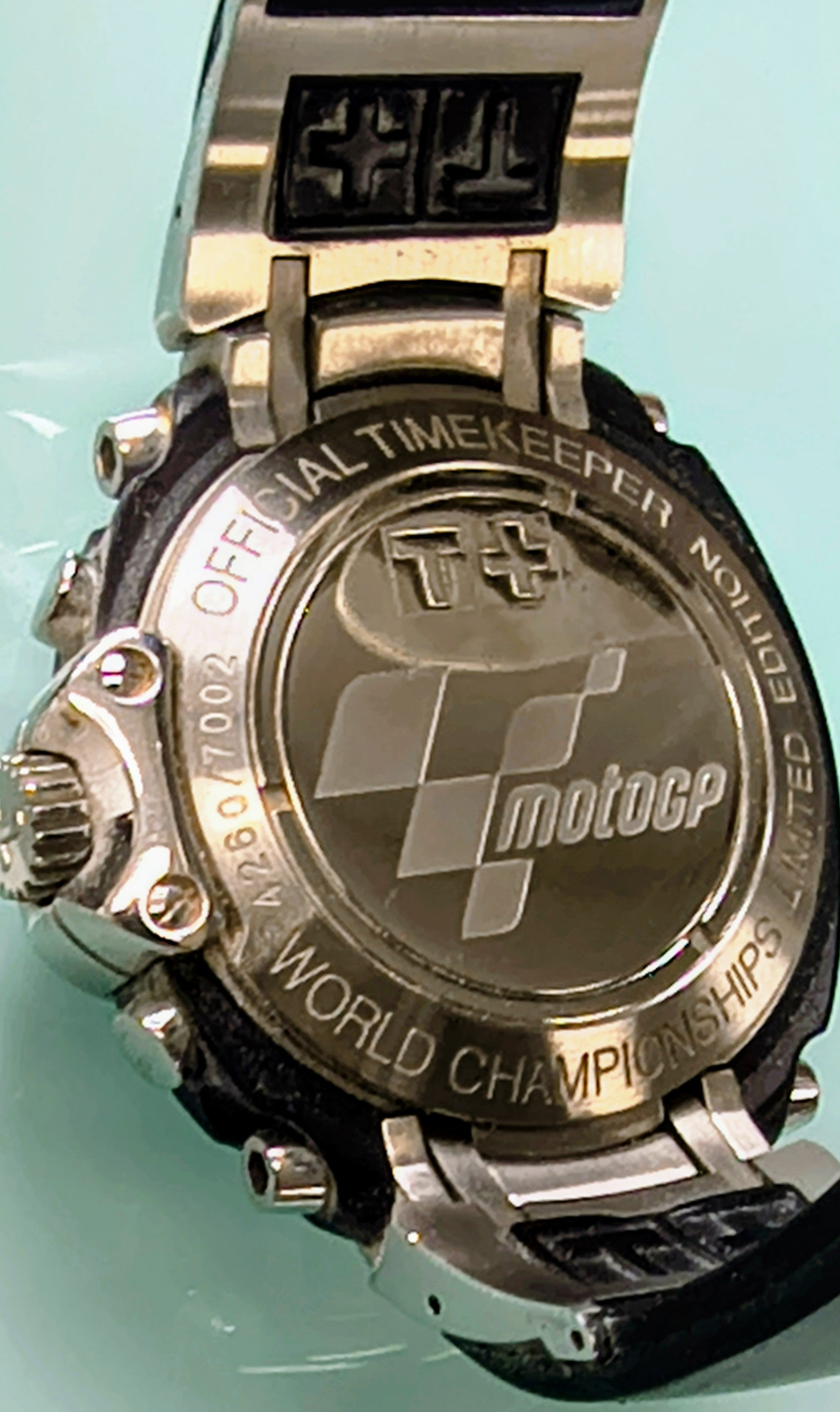 Rare Tissot T-Race MotoGP 2007 Limited Edition chronograph No. 1700/7002 with original helmet case, manuals, warranty card, and circuit medallions. Complete collector set.