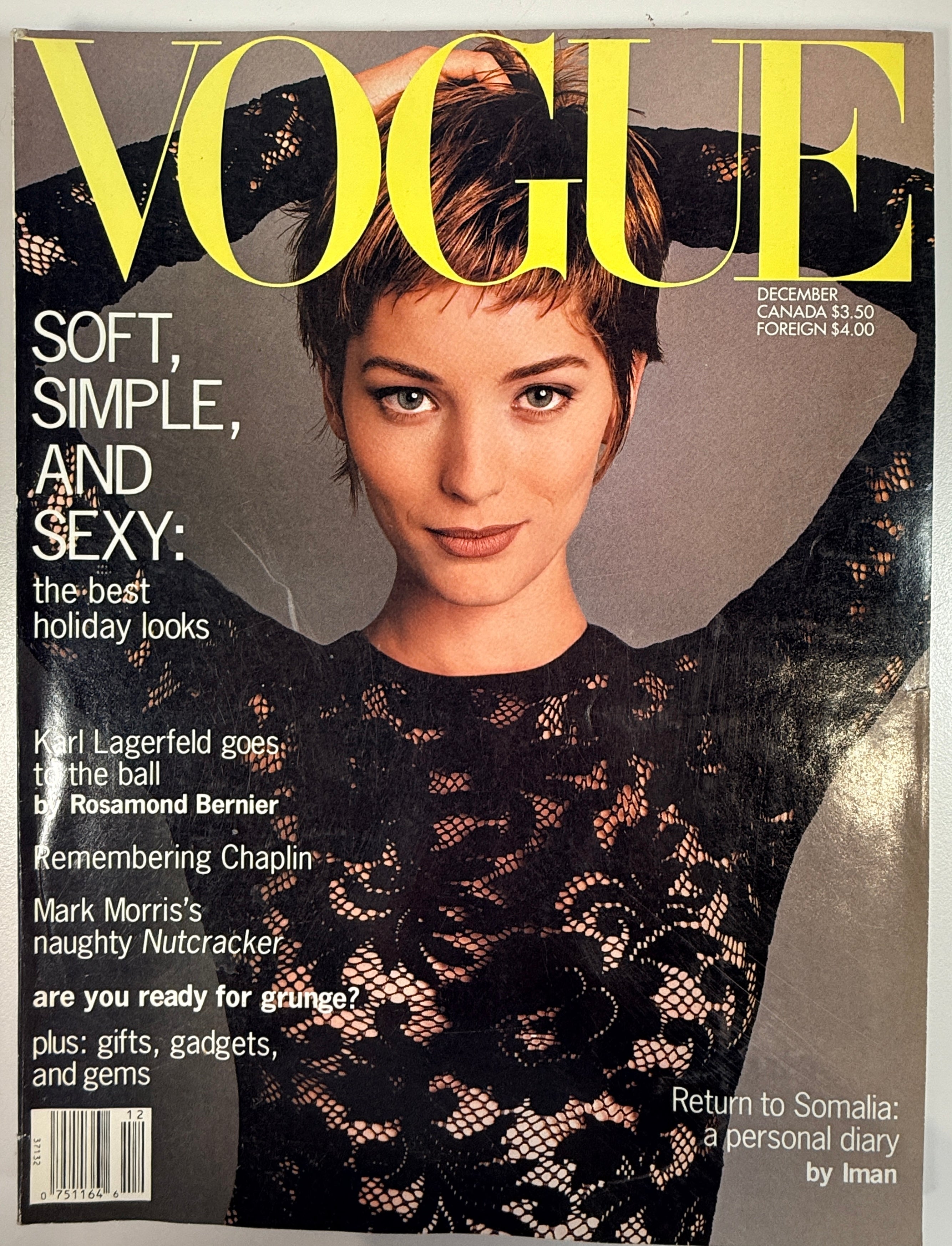Vintage Vogue US December 1992 magazine featuring Lucie De La Falaise. Classic 90s fashion editorial issue with designer ads, beauty content and cultural features.