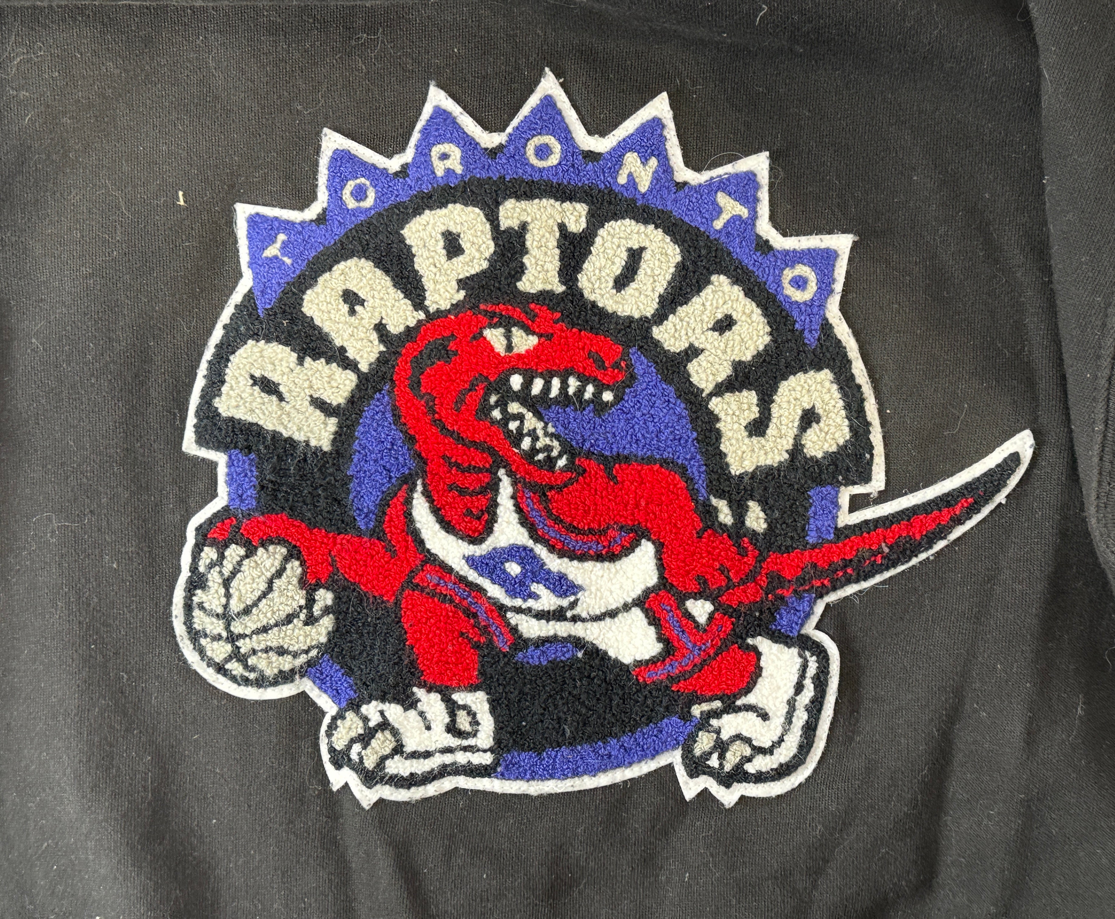 Vintage-style Toronto Raptors crewneck by Mitchell &amp; Ness with classic dinosaur logo. Clean, bold graphic. Great condition. Ships fast from Montreal.