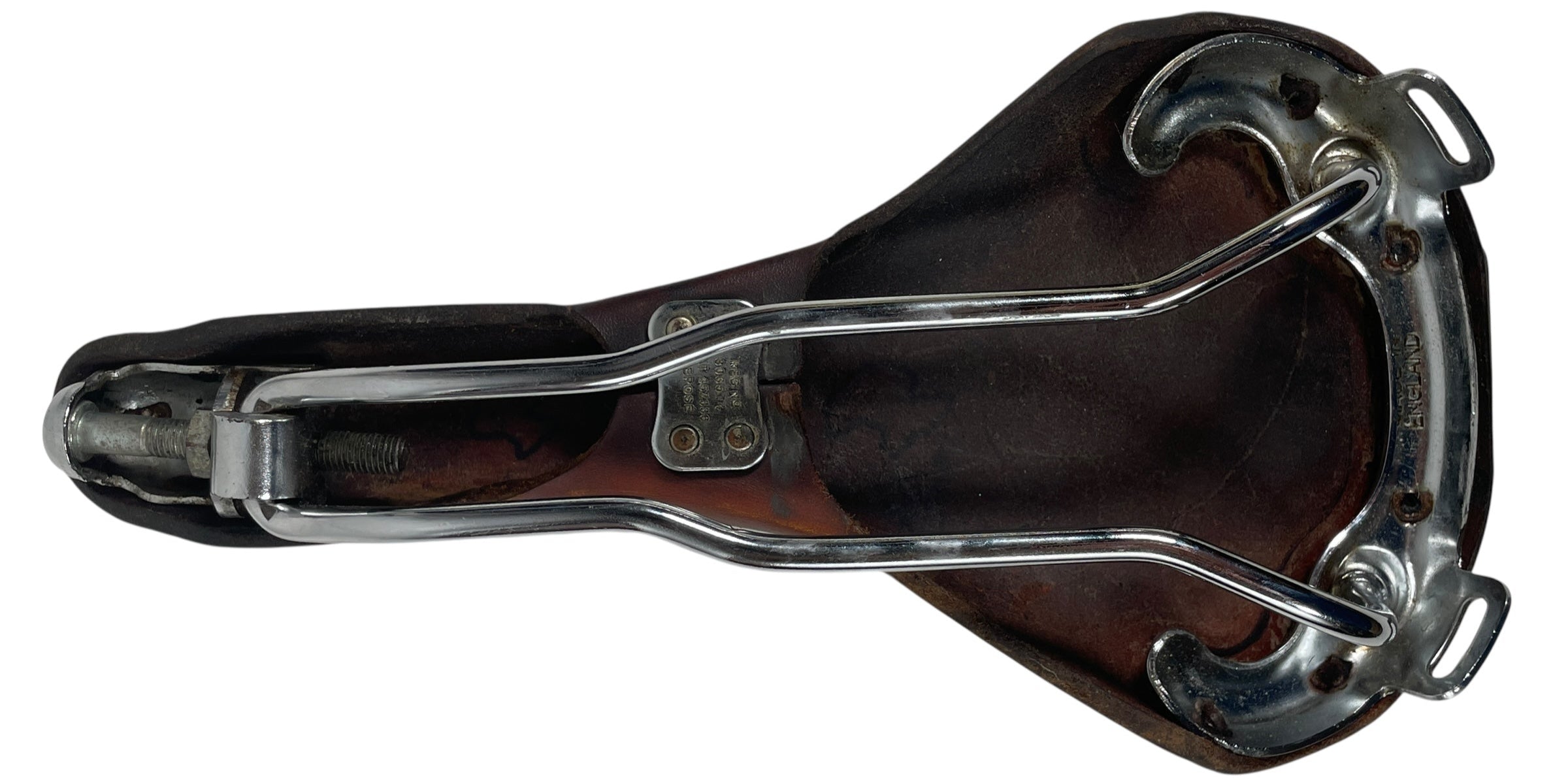 Brown leather bicycle seat with metal frame on a white background