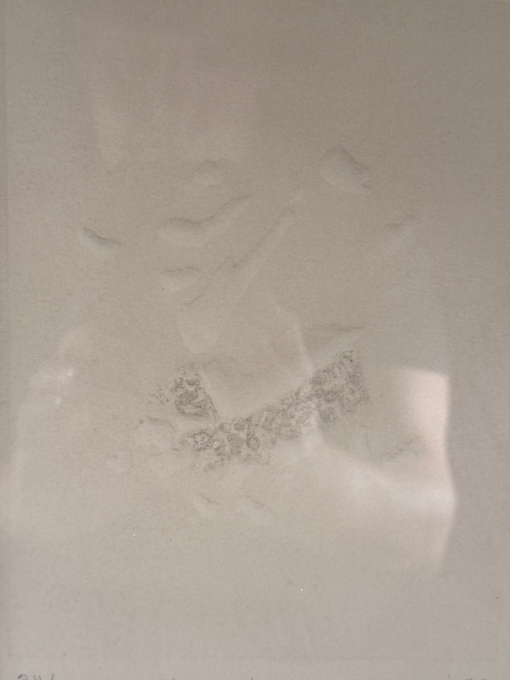 Abstract art with blurred shapes on a light gray background