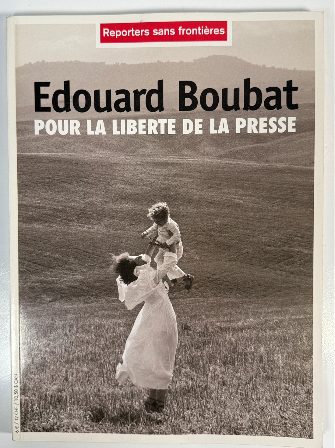 Book cover with text 'Edouard Boubat' and a black and white photo of two people.