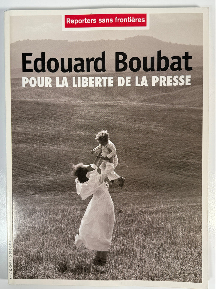 Book cover with text 'Edouard Boubat' and a black and white photo of two people.