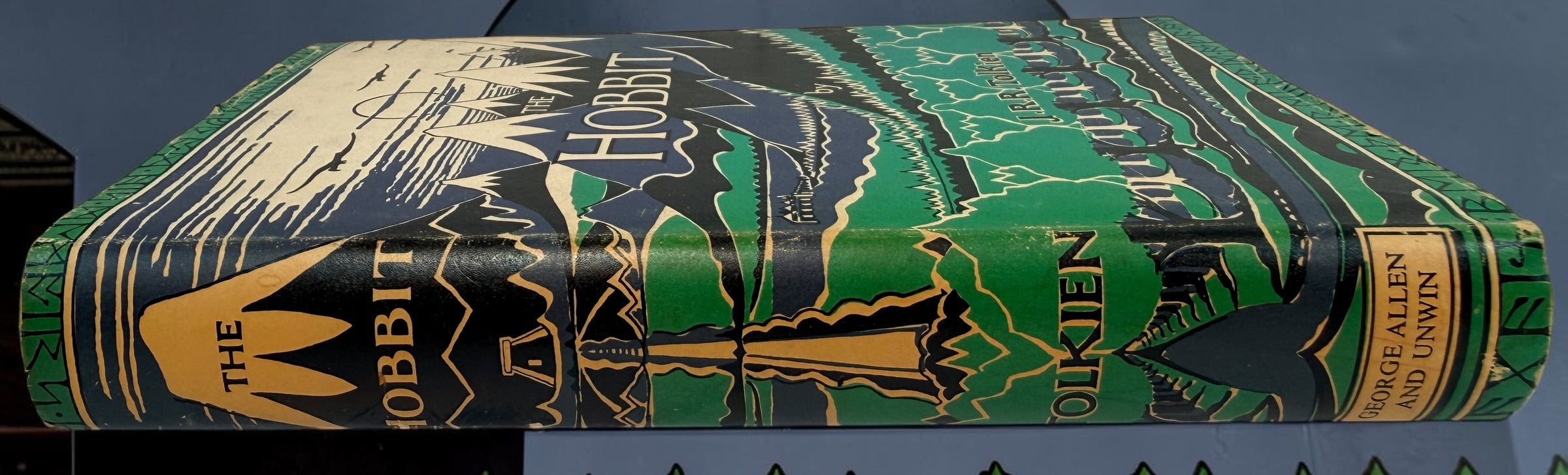 Collectible 1975 UK hardcover of Tolkien’s The Hobbit, Third Edition, Tenth Impression, with original illustrated dust jacket and endpaper maps.