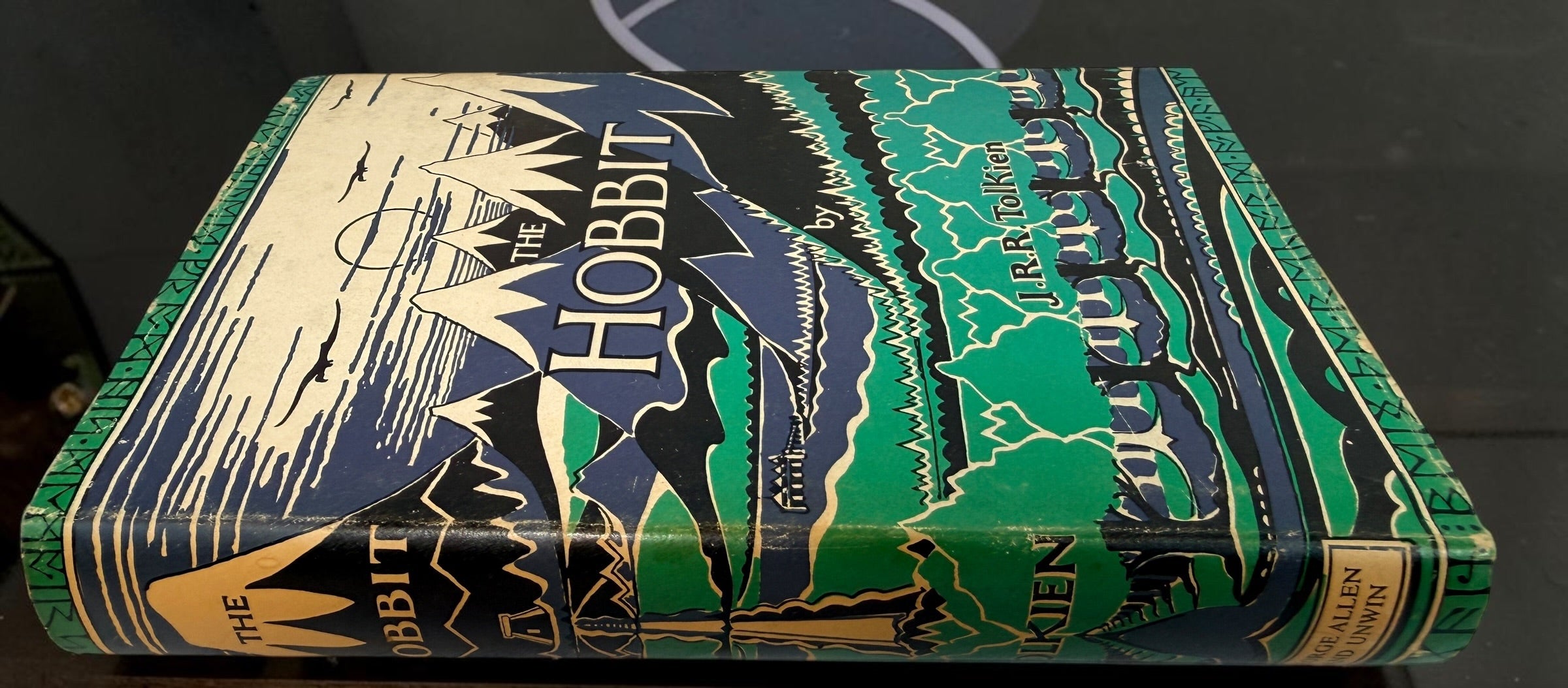 Collectible 1975 UK hardcover of Tolkien’s The Hobbit, Third Edition, Tenth Impression, with original illustrated dust jacket and endpaper maps.