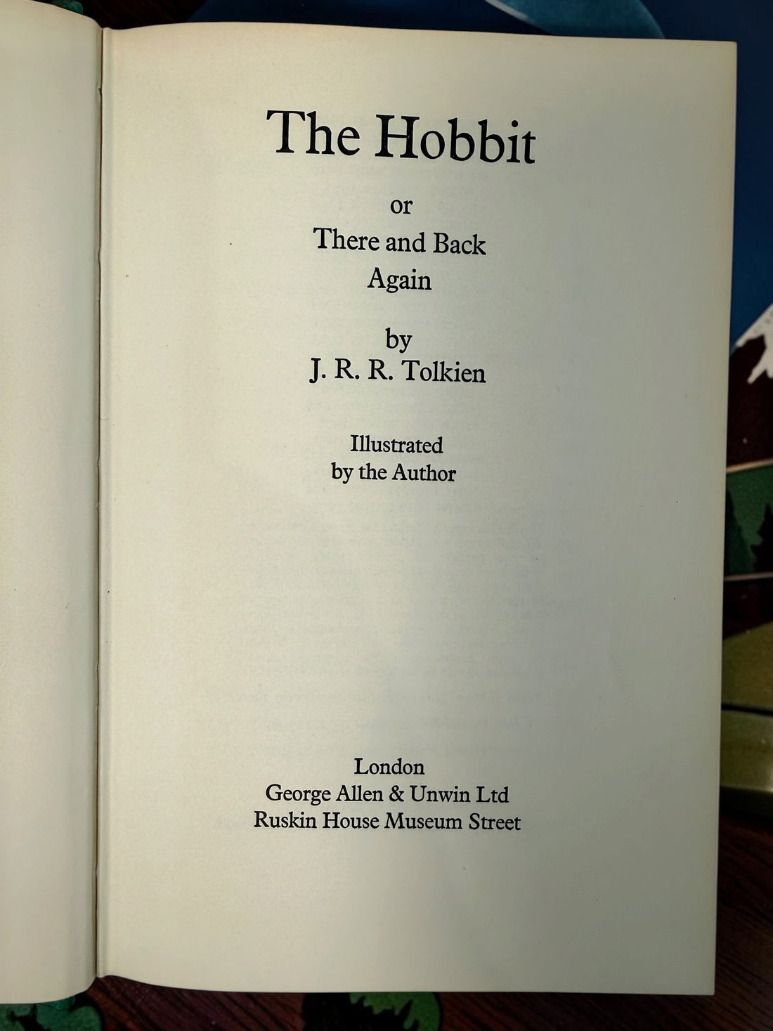 Collectible 1975 UK hardcover of Tolkien’s The Hobbit, Third Edition, Tenth Impression, with original illustrated dust jacket and endpaper maps.