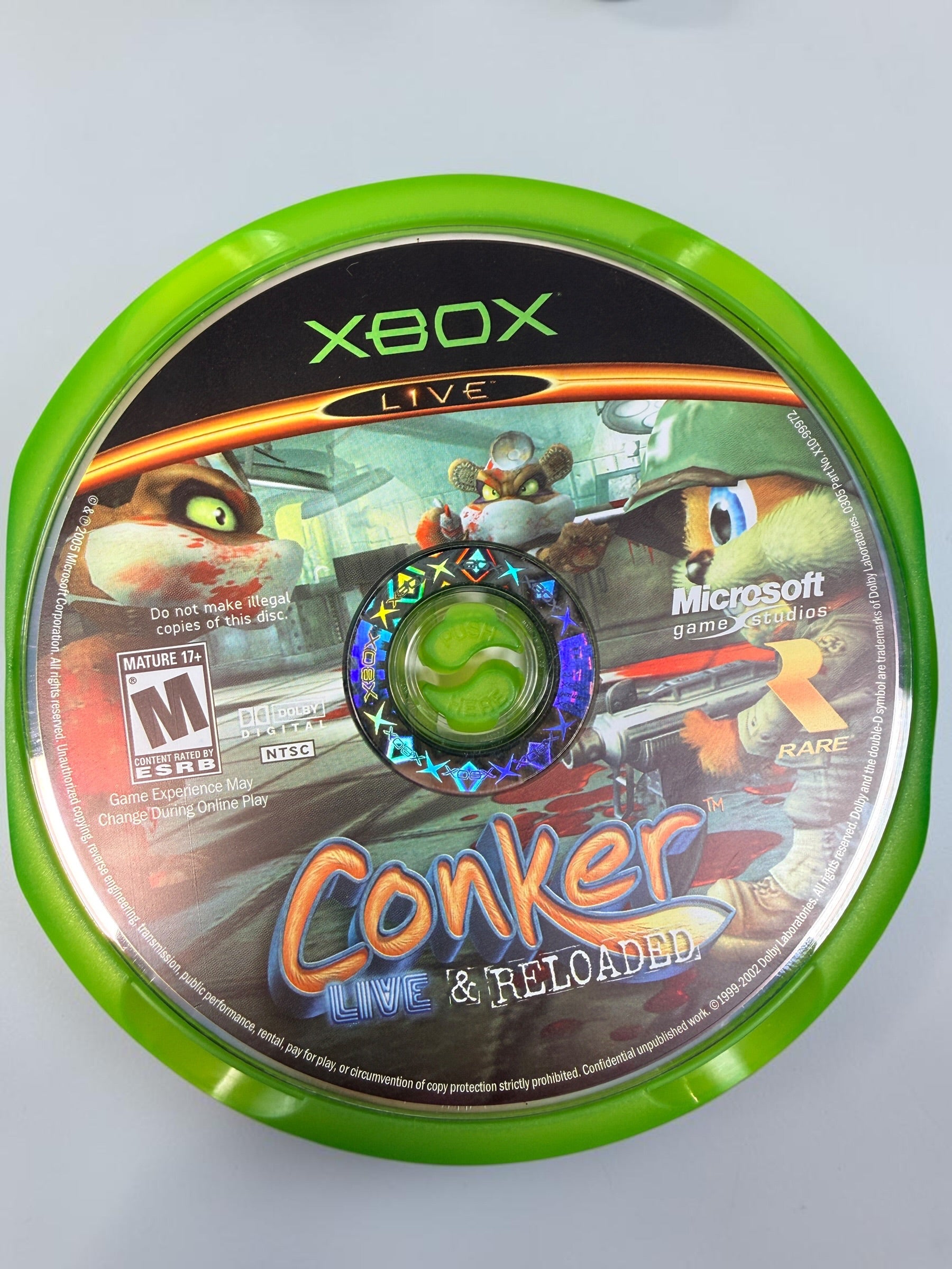 Conker: Live &amp; Reloaded for original Xbox, 2005 NTSC edition with disc, case and manual. Pre-owned, visibly worn and untested.