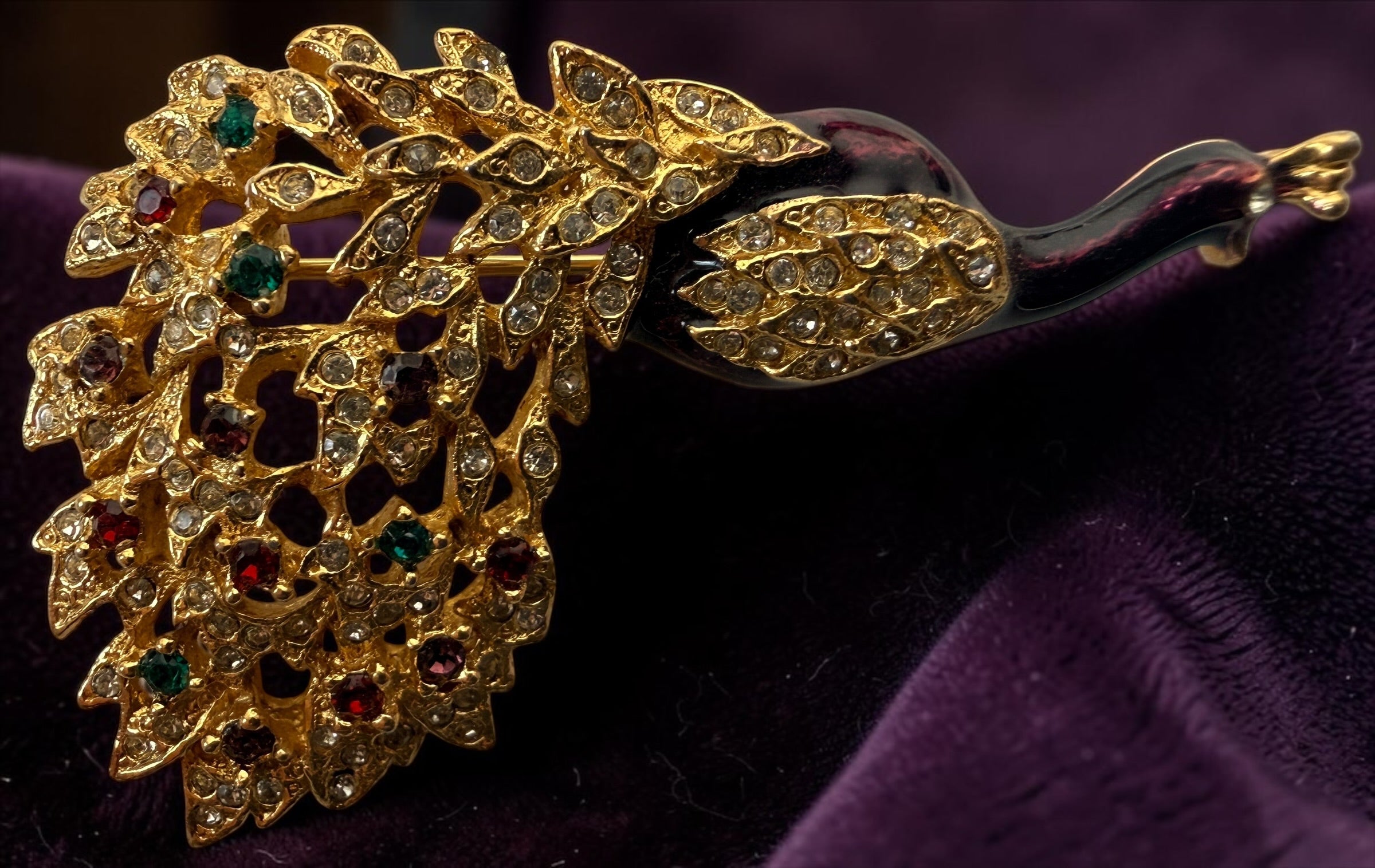 Vintage signed Sphinx 2046 peacock brooch with purple enamel, gold-tone openwork and colourful rhinestones. British costume jewellery.