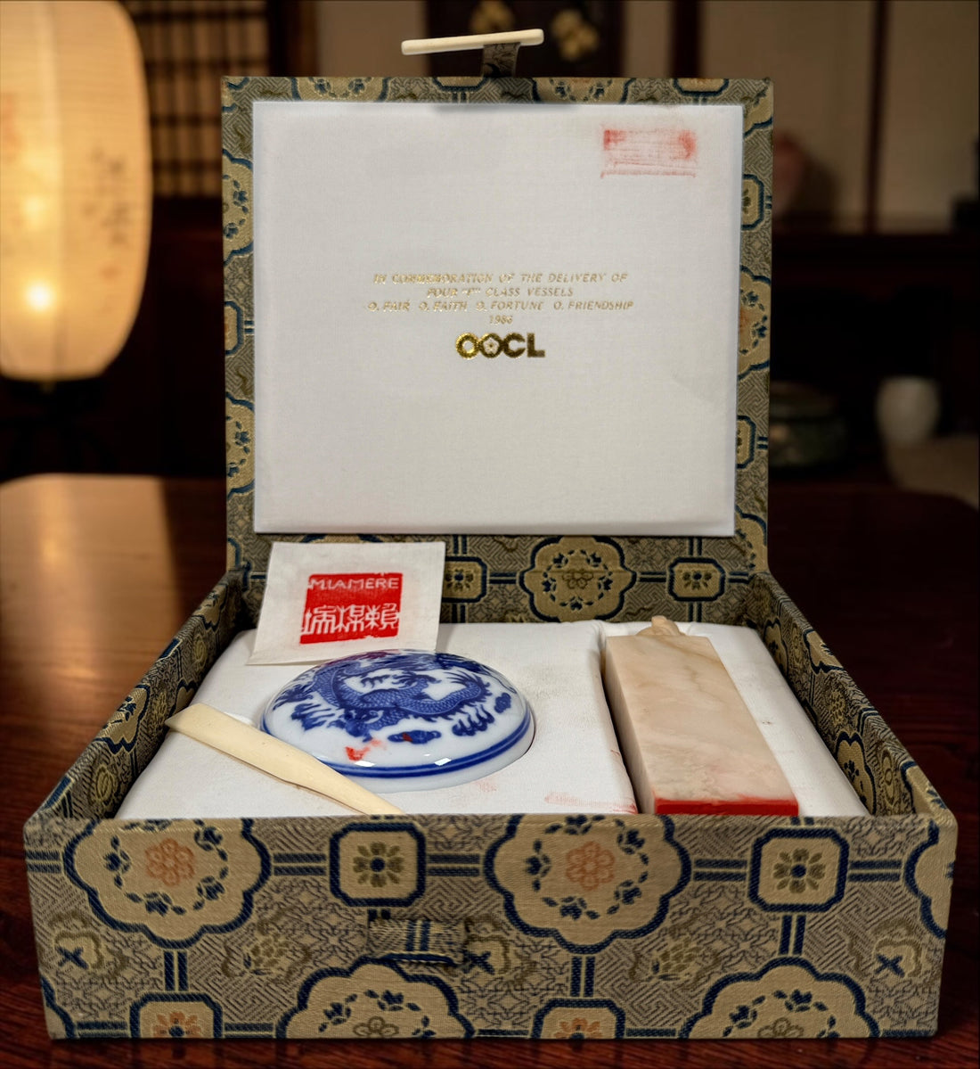 Vintage 1986 OOCL Chinese carved soapstone chop seal set with porcelain paste box, spatula and original brocade presentation case.