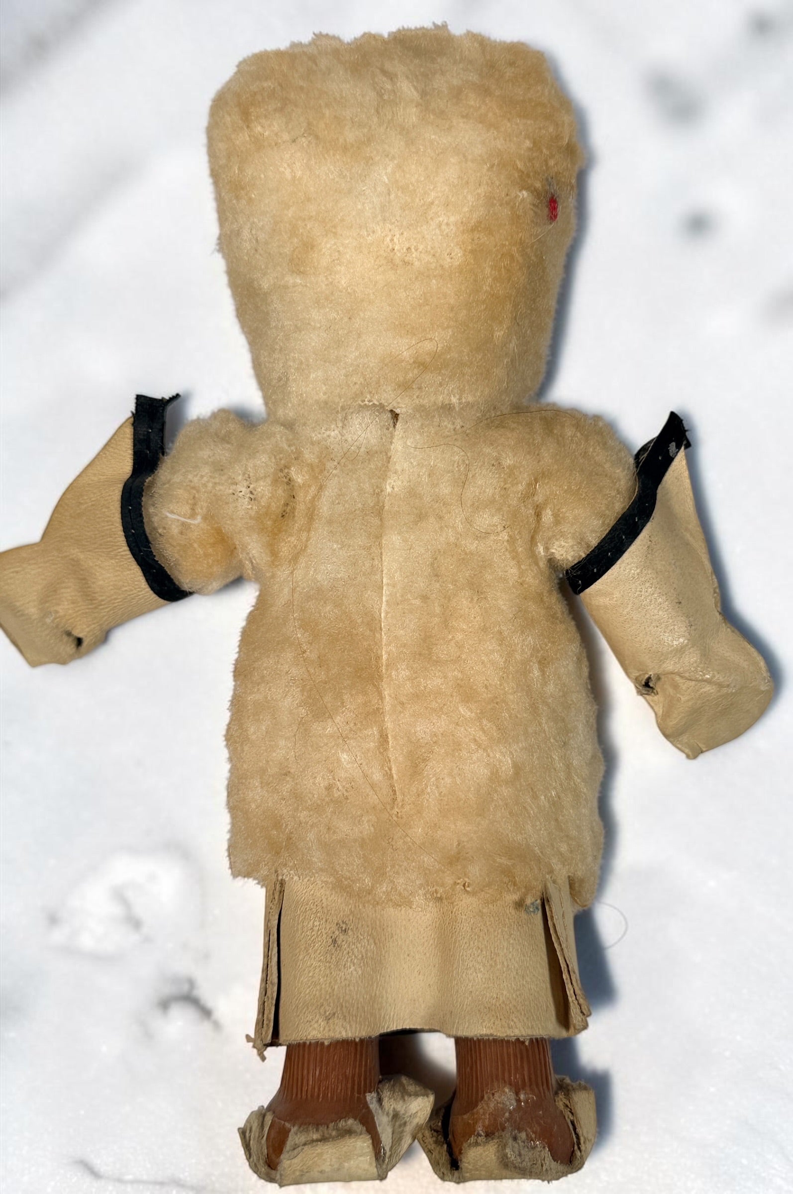 Vintage Hong Kong Inuit-style souvenir doll with sleep eyes, faux-fur parka and beaded footwear. 1960s–1970s collectible in worn condition.