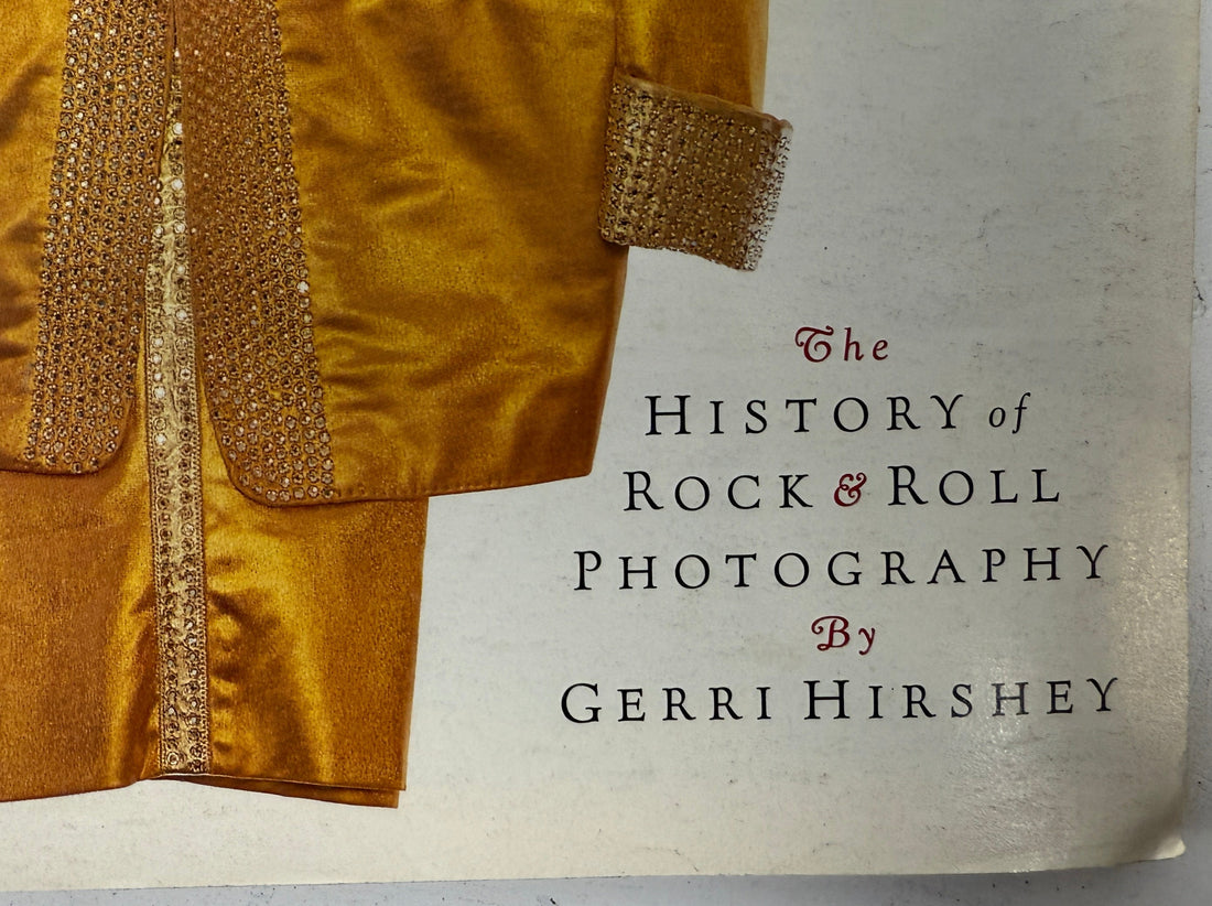 Book cover of 'Portraits: The History of Rock & Roll Photography' by Gerri Hirshey with a gold jacket design.
