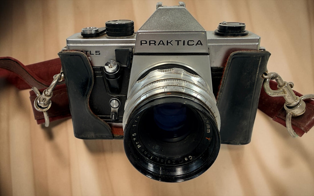 Vintage Praktica MTL 5 East German 35mm SLR with Carl Zeiss Jena Biotar 58mm f/2 M42 lens, cases and strap. Untested and sold as-is.