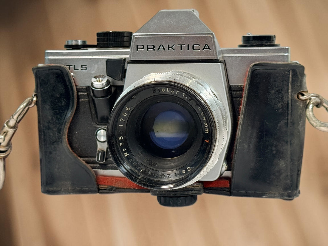 Vintage Praktica MTL 5 East German 35mm SLR with Carl Zeiss Jena Biotar 58mm f/2 M42 lens, cases and strap. Untested and sold as-is.