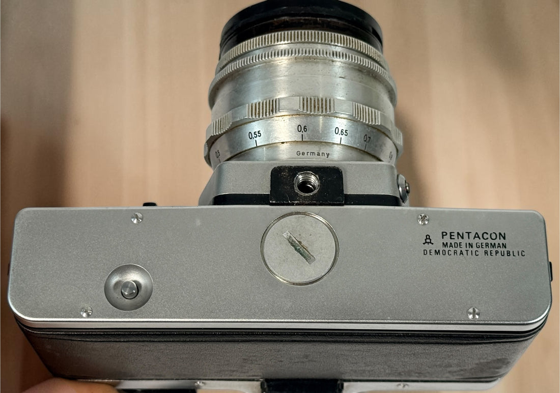 Vintage Praktica MTL 5 East German 35mm SLR with Carl Zeiss Jena Biotar 58mm f/2 M42 lens, cases and strap. Untested and sold as-is.