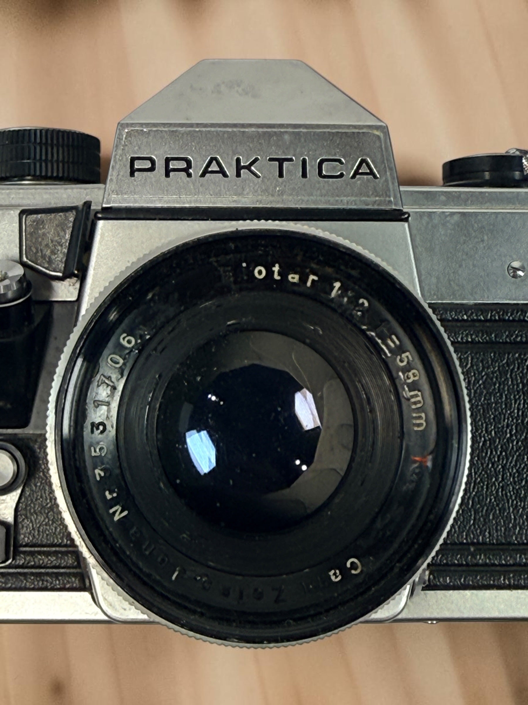 Vintage Praktica MTL 5 East German 35mm SLR with Carl Zeiss Jena Biotar 58mm f/2 M42 lens, cases and strap. Untested and sold as-is.