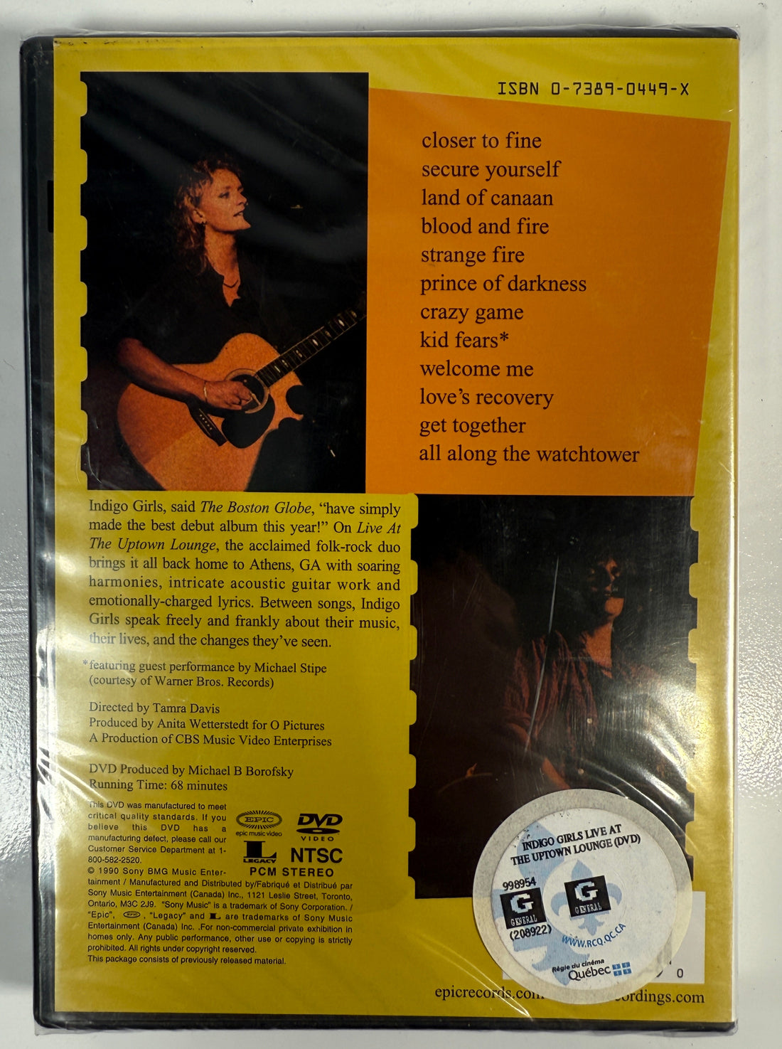 DVD case with a person playing guitar on a yellow background