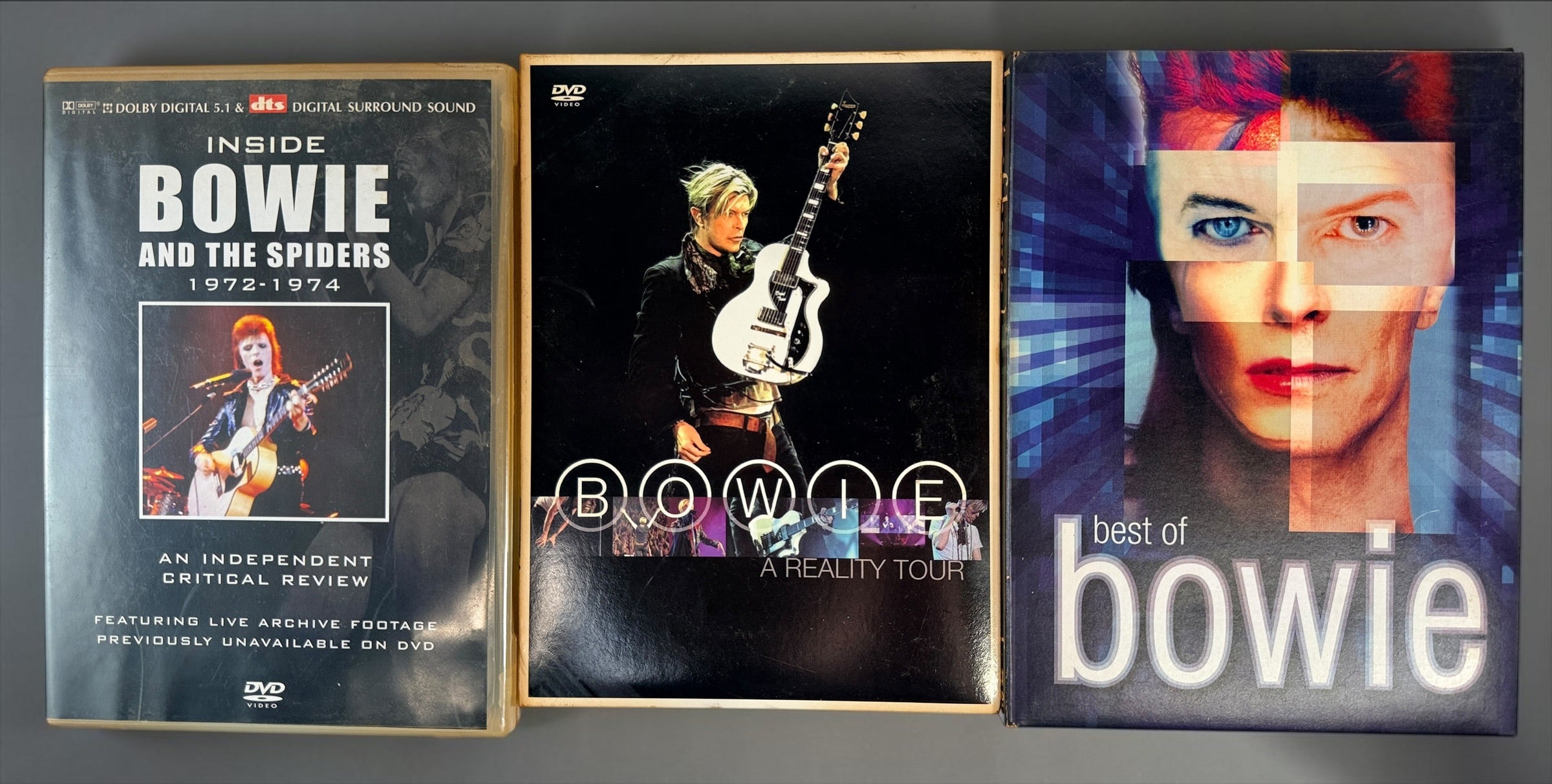 David Bowie 4-disc DVD lot with Best of Bowie, A Reality Tour and Inside Bowie and the Spiders 1972–1974. Pre-owned collector set