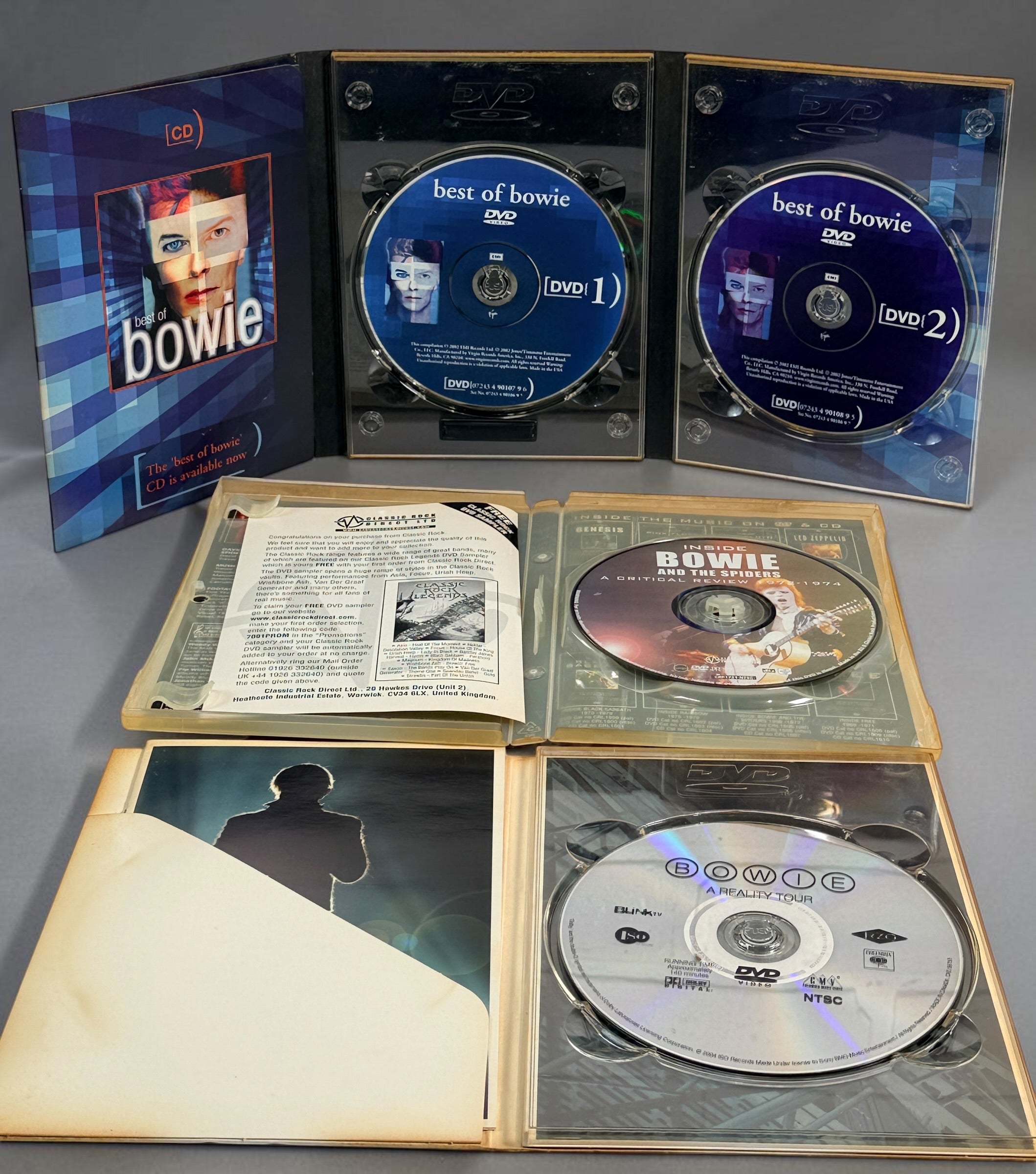 David Bowie 4-disc DVD lot with Best of Bowie, A Reality Tour and Inside Bowie and the Spiders 1972–1974. Pre-owned collector set