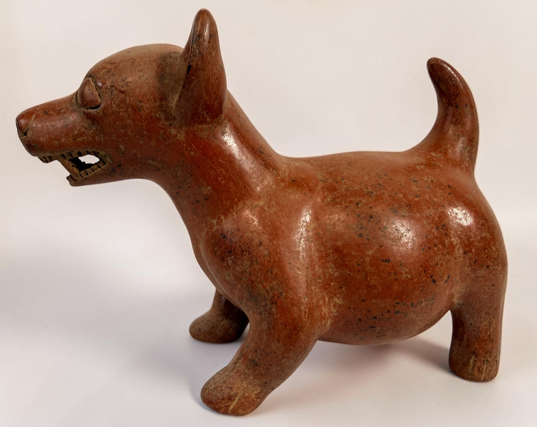 Vintage Mexican Colima-style redware pottery dog with aged patina, expressive teeth and GP mark. Decorative pre-Columbian revival folk art.