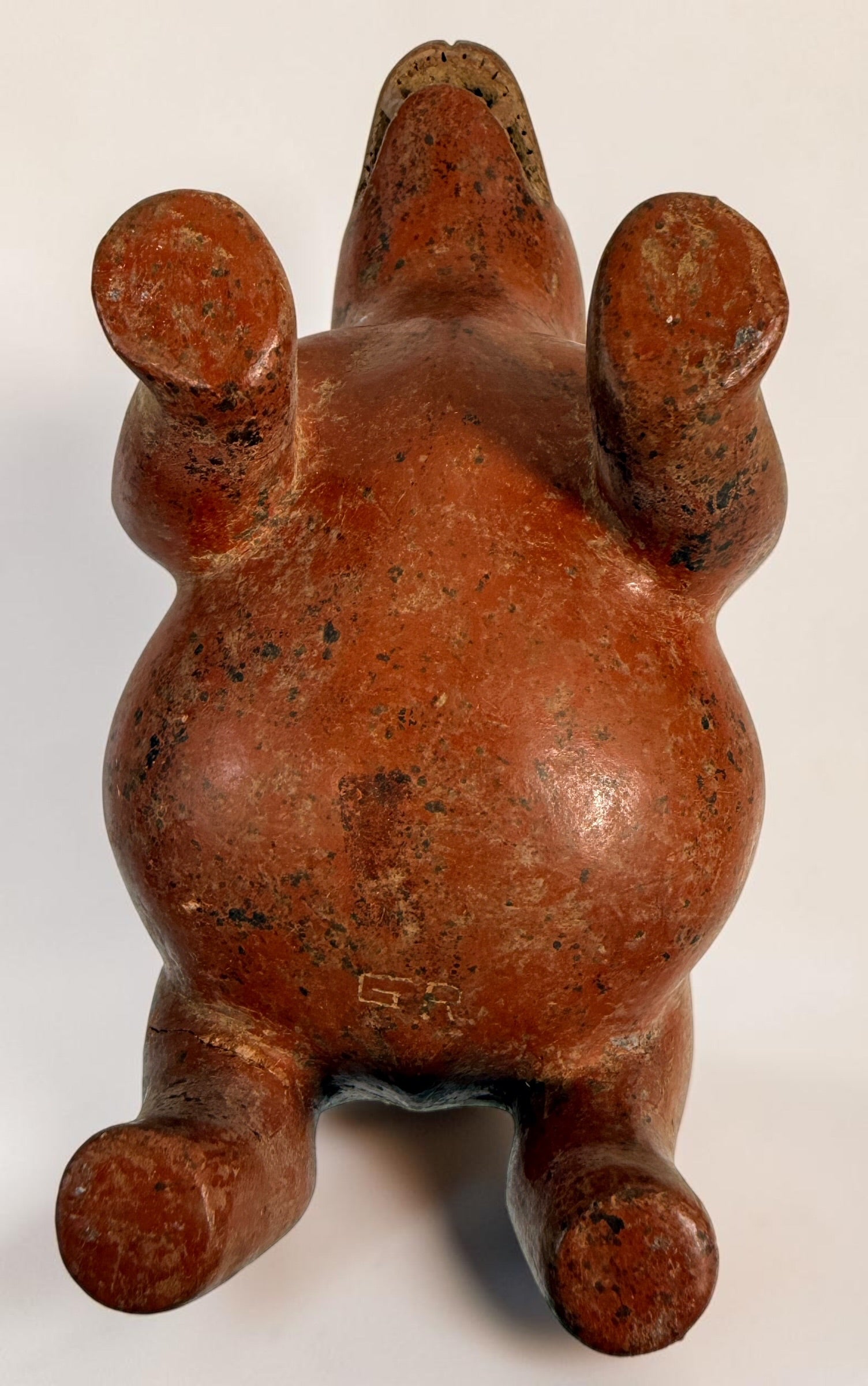 Vintage Mexican Colima-style redware pottery dog with aged patina, expressive teeth and GP mark. Decorative pre-Columbian revival folk art.