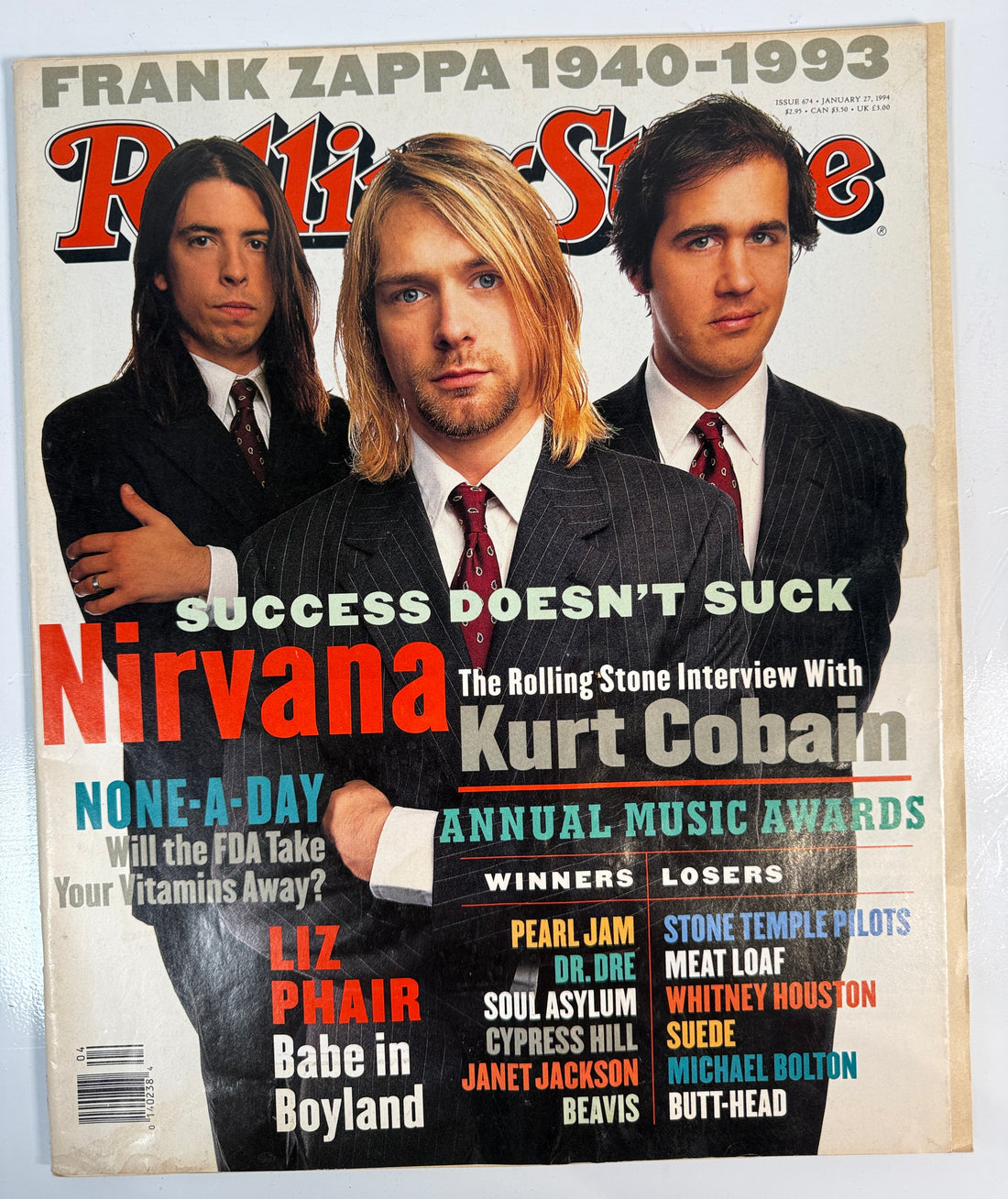 Magazine cover featuring Nirvana with text about Frank Zappa and Kurt Cobain.