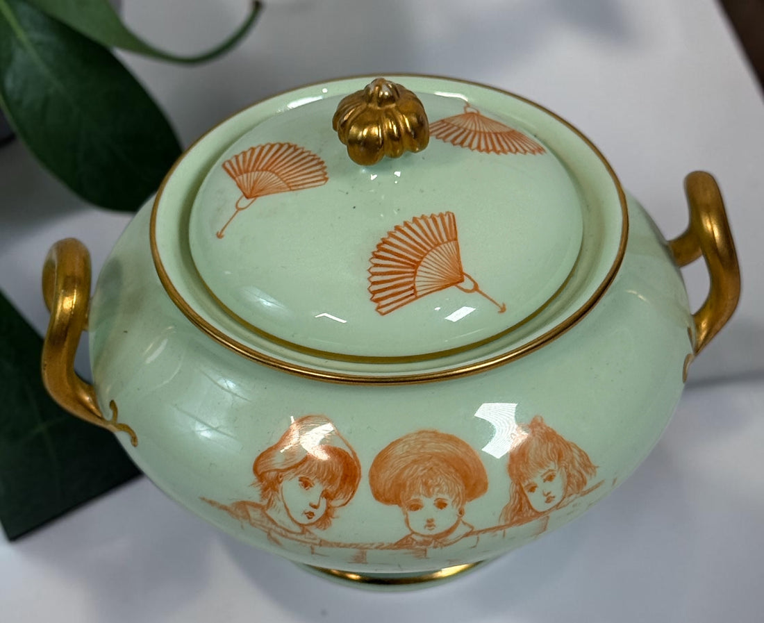 Celadon porcelain wash set with pitcher and covered chamber pot, hand-painted children, gold trim and M.A.P. signature; antique or vintage replica status unconfirmed.
