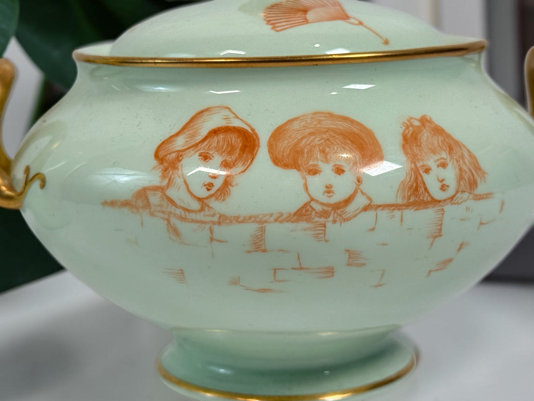 Celadon porcelain wash set with pitcher and covered chamber pot, hand-painted children, gold trim and M.A.P. signature; antique or vintage replica status unconfirmed.