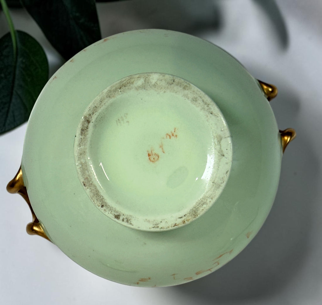 Celadon porcelain wash set with pitcher and covered chamber pot, hand-painted children, gold trim and M.A.P. signature; antique or vintage replica status unconfirmed.