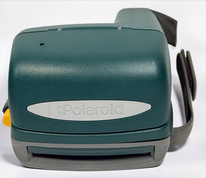 Vintage green Polaroid OneStep Express instant camera for 600 film with built-in flash and close-up mode. Untested and sold as-is.