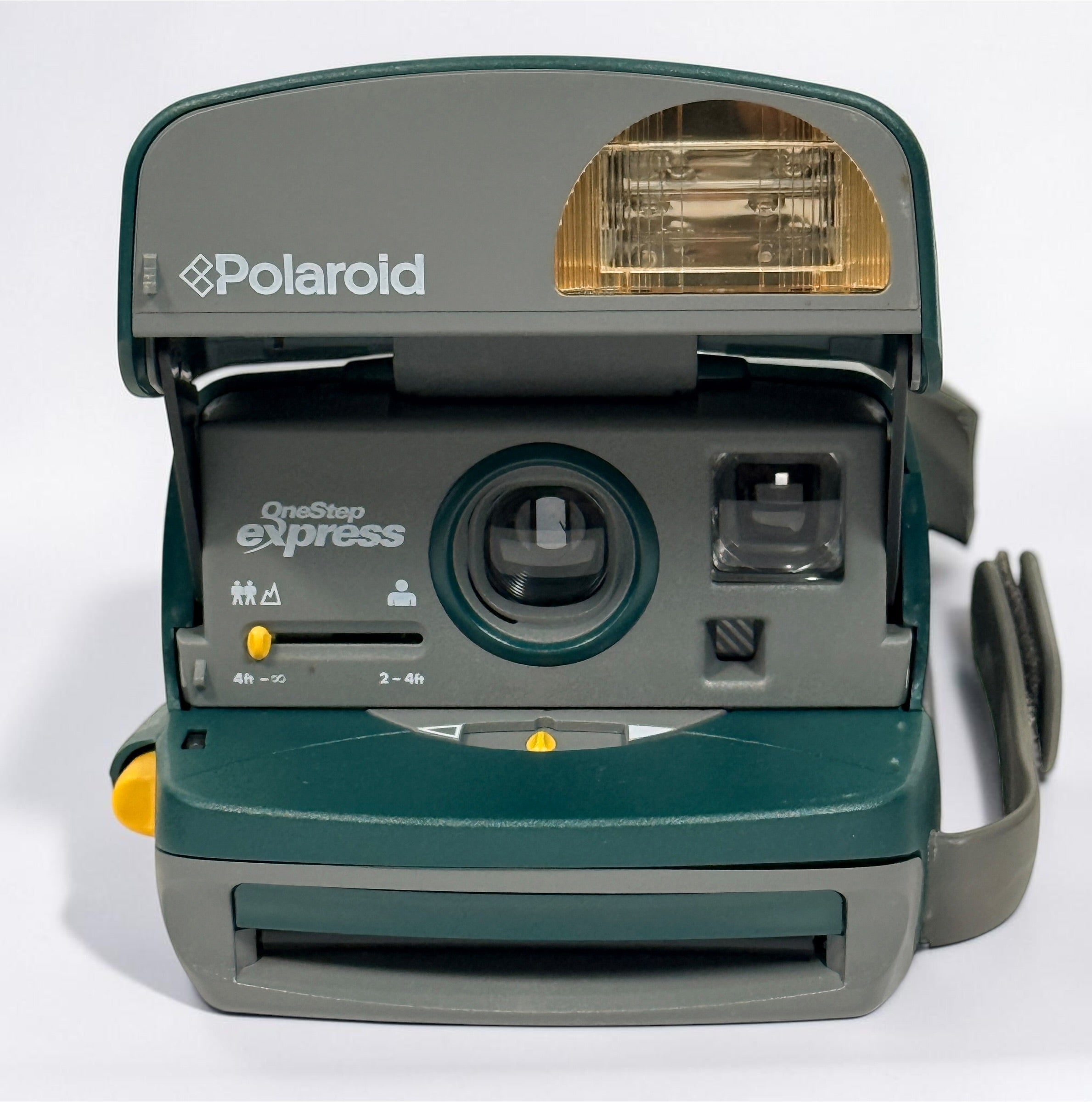 Vintage green Polaroid OneStep Express instant camera for 600 film with built-in flash and close-up mode. Untested and sold as-is.