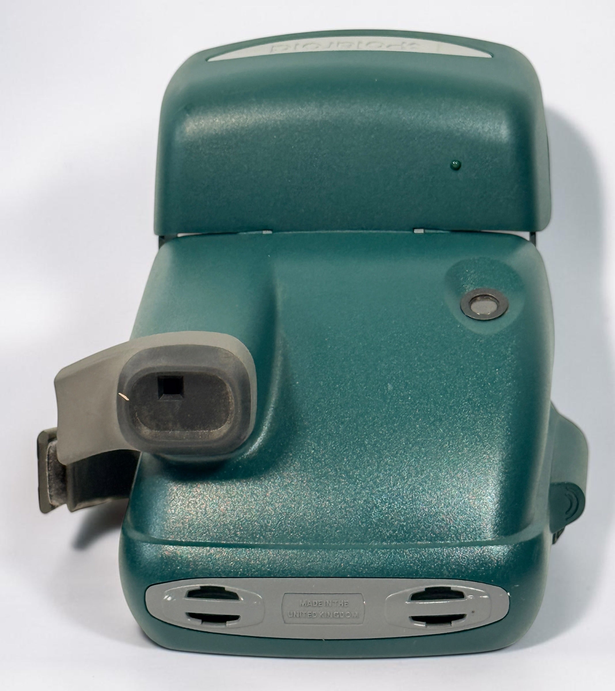 Vintage green Polaroid OneStep Express instant camera for 600 film with built-in flash and close-up mode. Untested and sold as-is.