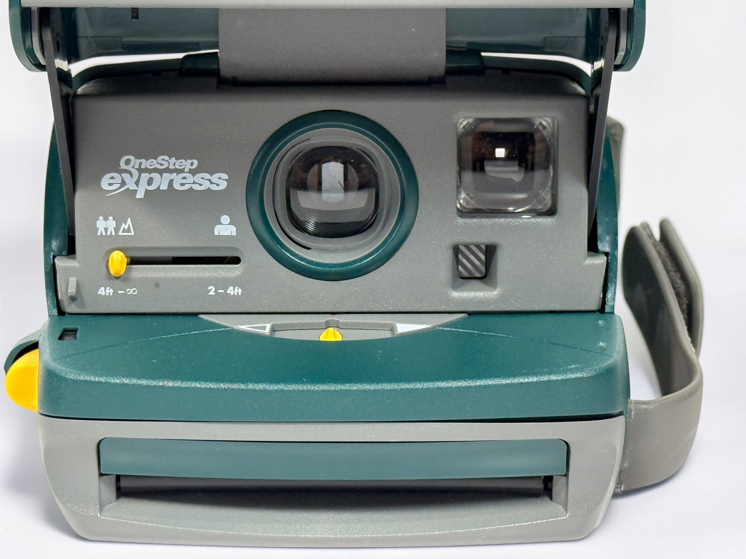 Vintage green Polaroid OneStep Express instant camera for 600 film with built-in flash and close-up mode. Untested and sold as-is.