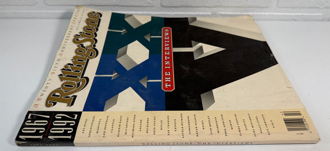 Rolling Stone magazine cover with a black and white abstract design on a white surface.