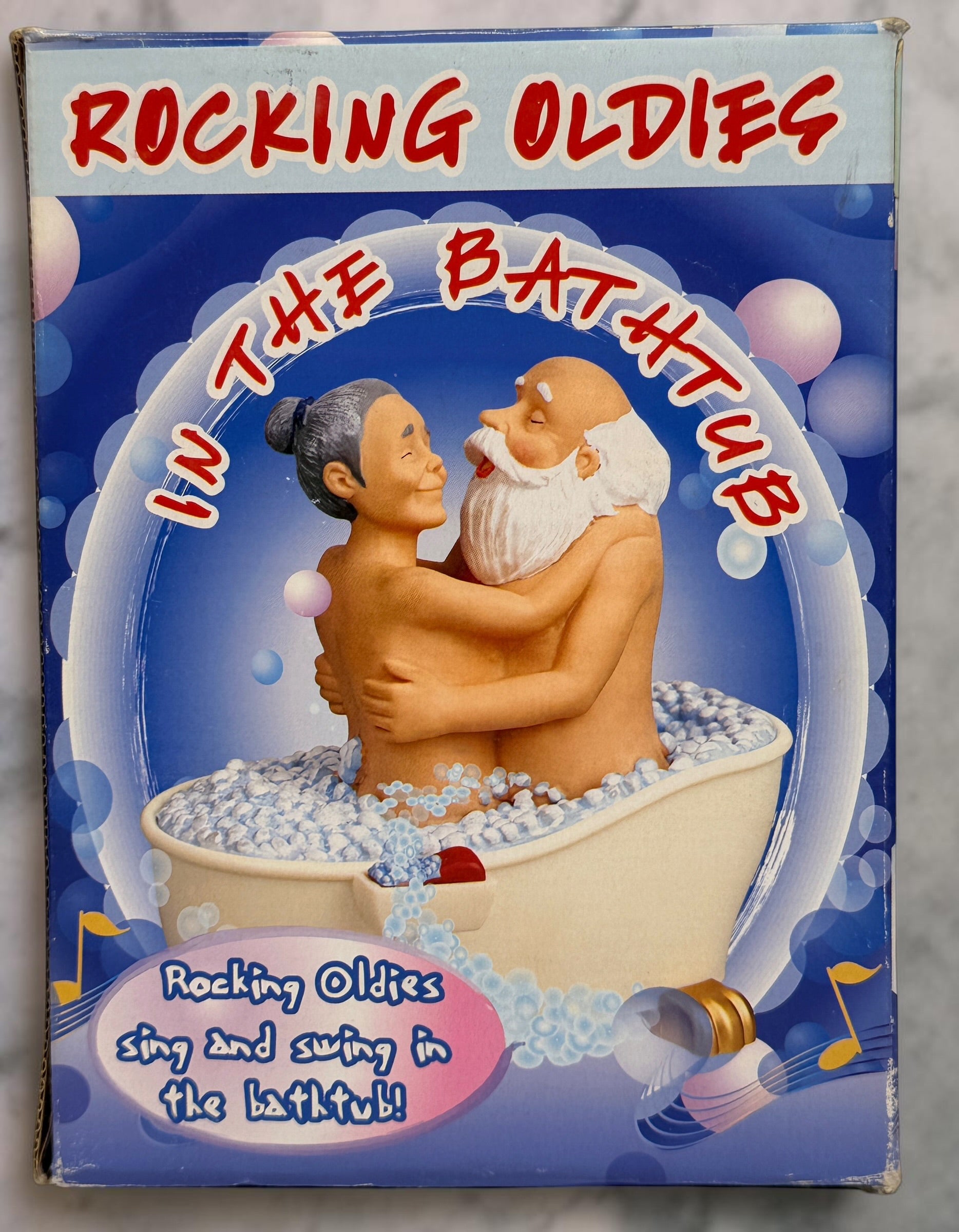 Vintage Rocking Oldies sound-activated musical bathtub couple figurine with animated movement and original box. Works fine and sold as-is.