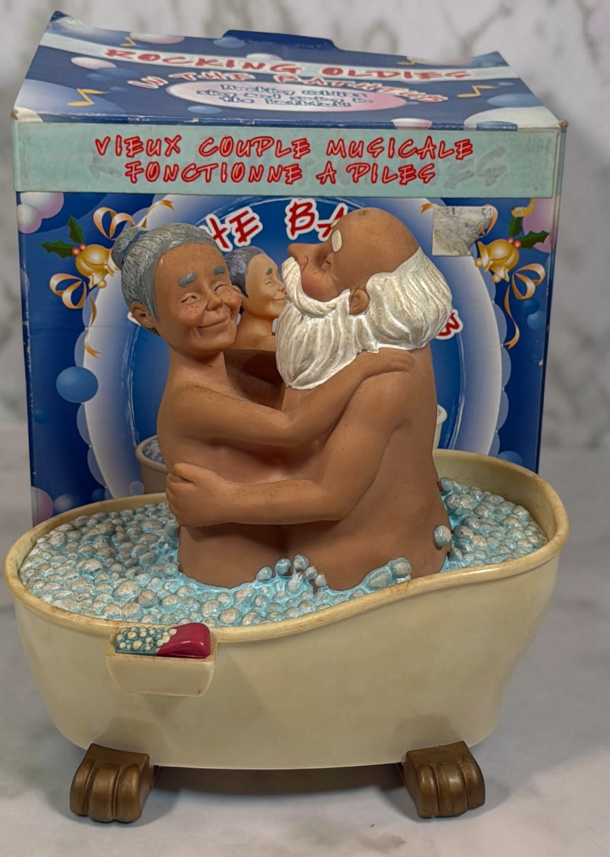 Vintage Rocking Oldies sound-activated musical bathtub couple figurine with animated movement and original box. Works fine and sold as-is.