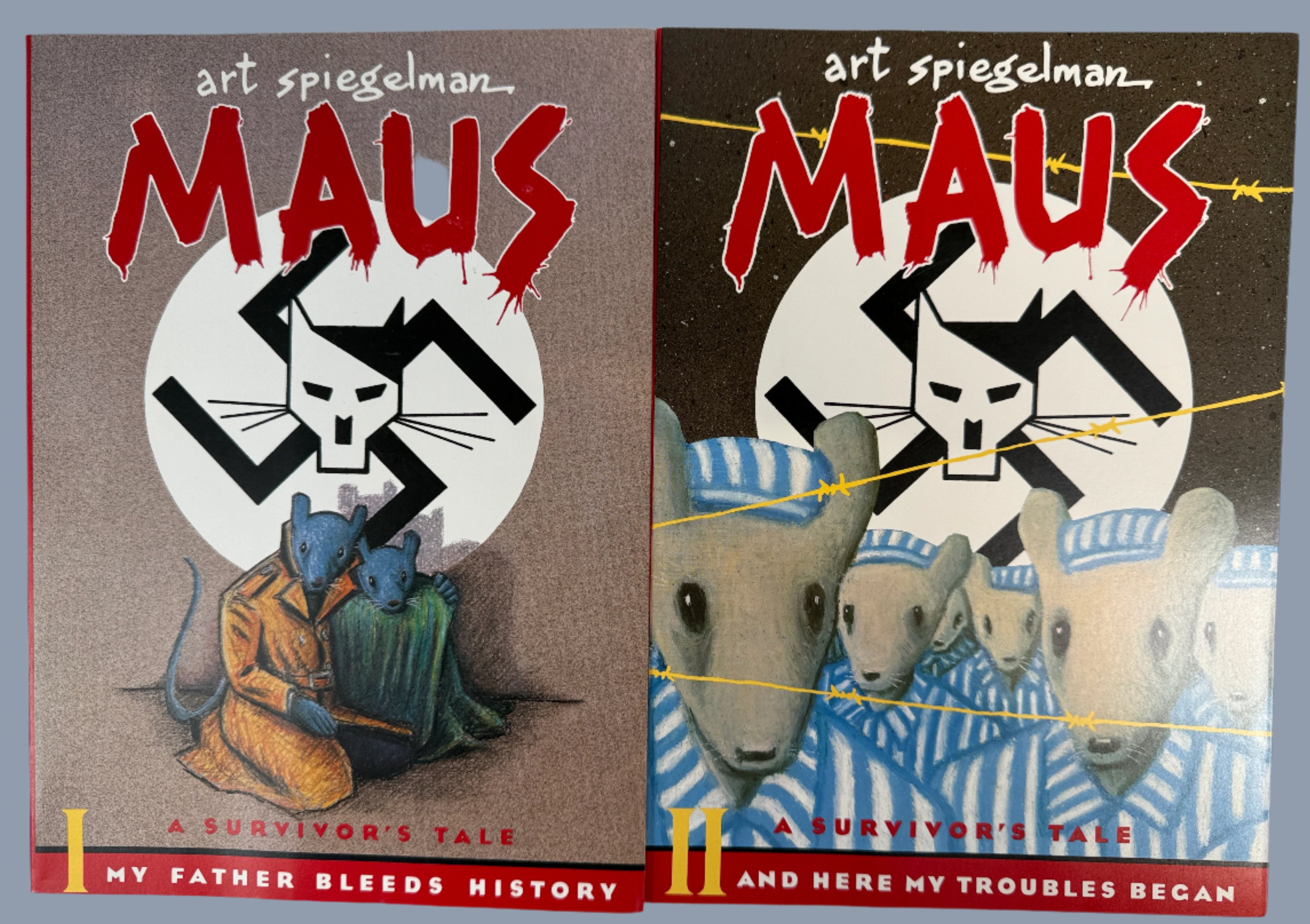Two books titled 'Maus' by Art Spiegelman on a white background