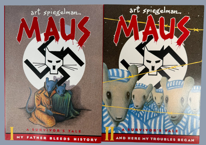 Two books titled 'Maus' by Art Spiegelman on a white background