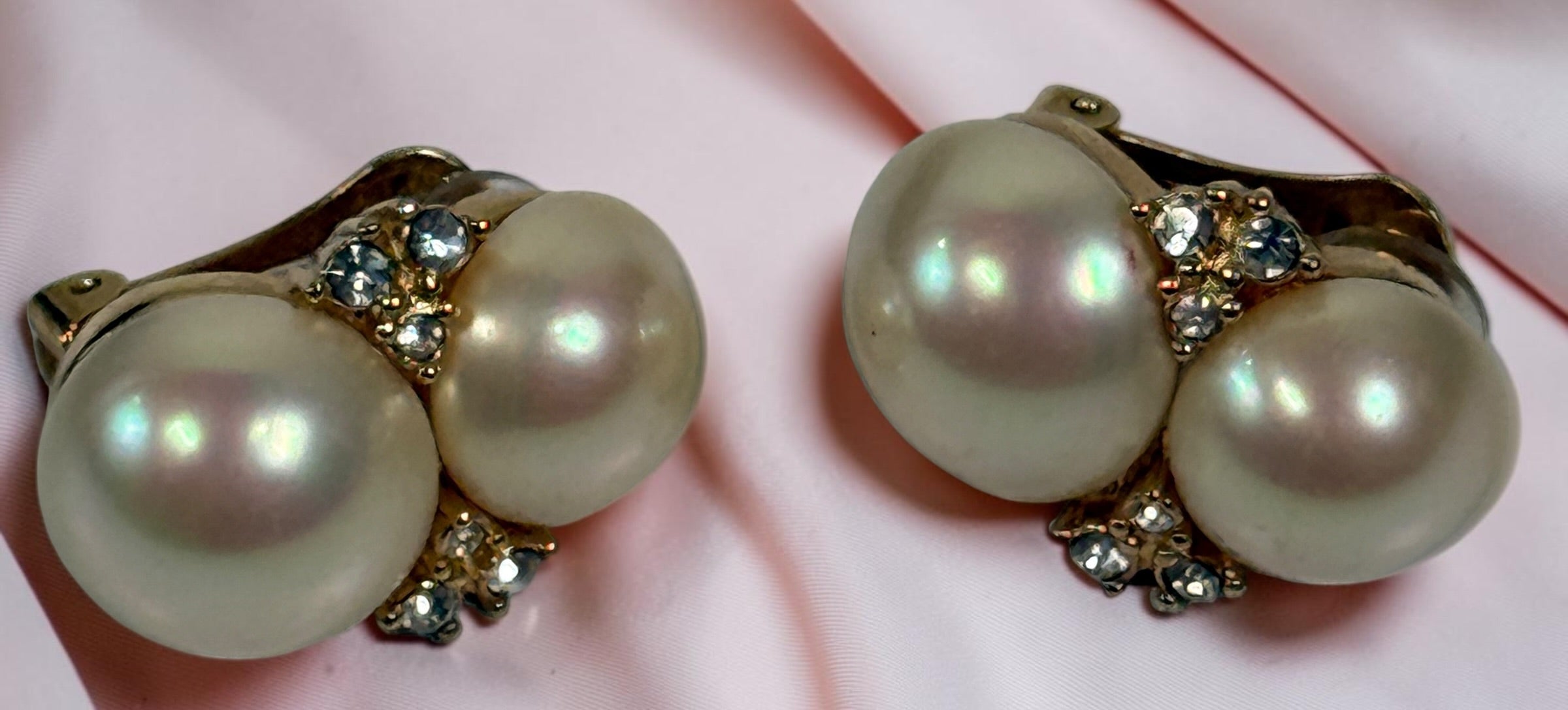 Signed vintage Christian Dior clip earrings with double simulated pearls, clear crystals and gold-tone finish. Elegant collectible designer jewellry.