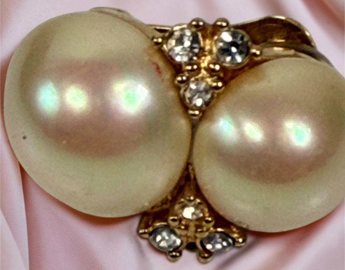 Signed vintage Christian Dior clip earrings with double simulated pearls, clear crystals and gold-tone finish. Elegant collectible designer jewelry.
