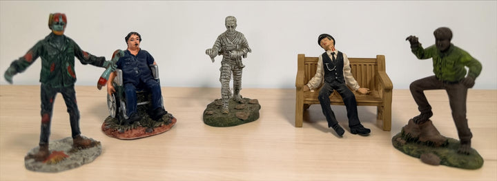Retired Hawthorne Village horror figurine lot with Wolf Man, Mummy, Conductor, Franklin and Dawn of the Dead Helicopter Zombie.