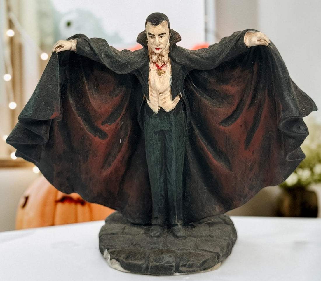 Lot of three retired Hawthorne Village Dracula and Munsters resin figurines, including Grandpa Getting Comfy. Vintage Universal Monsters decor