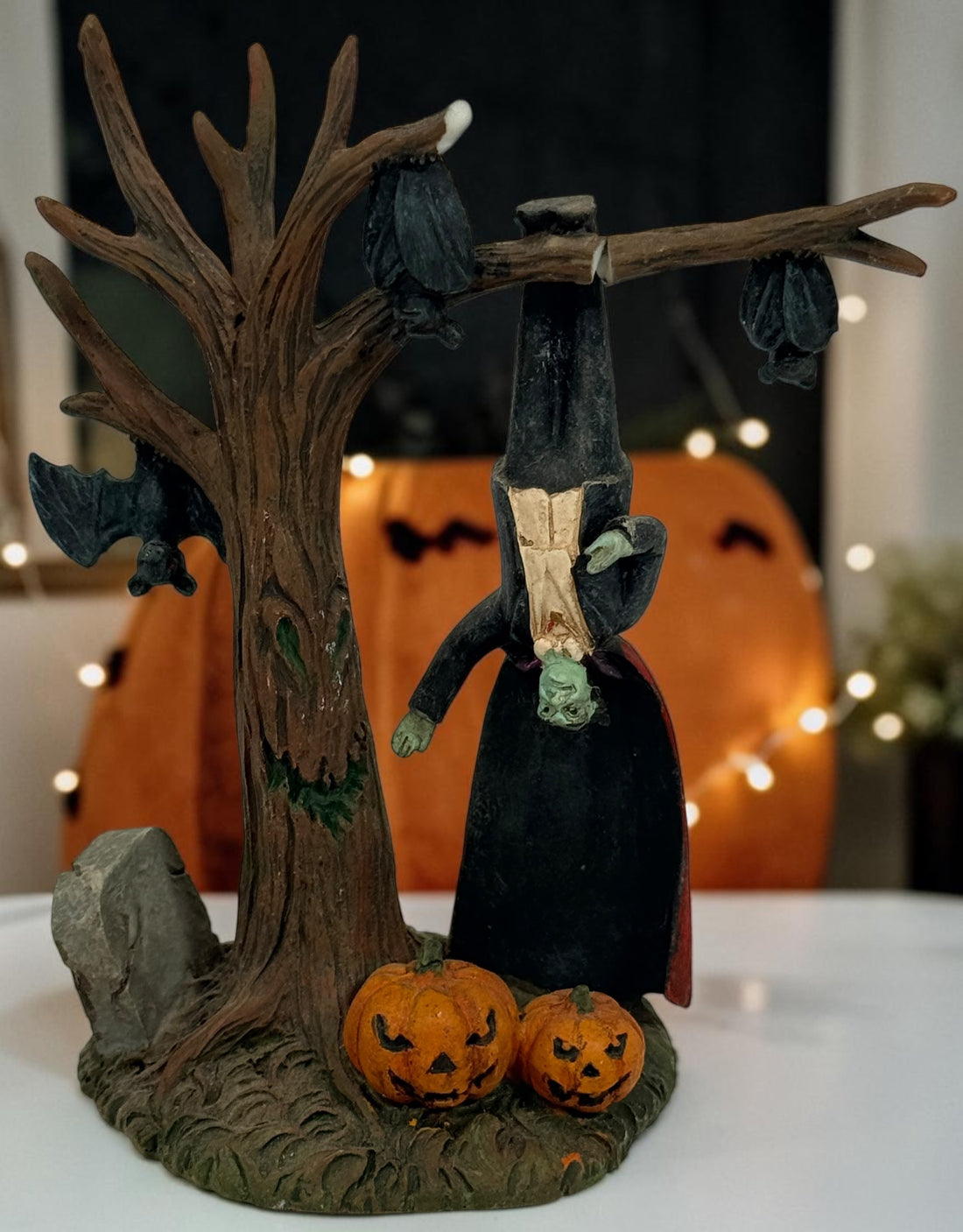 Lot of three retired Hawthorne Village Dracula and Munsters resin figurines, including Grandpa Getting Comfy. Vintage Universal Monsters decor